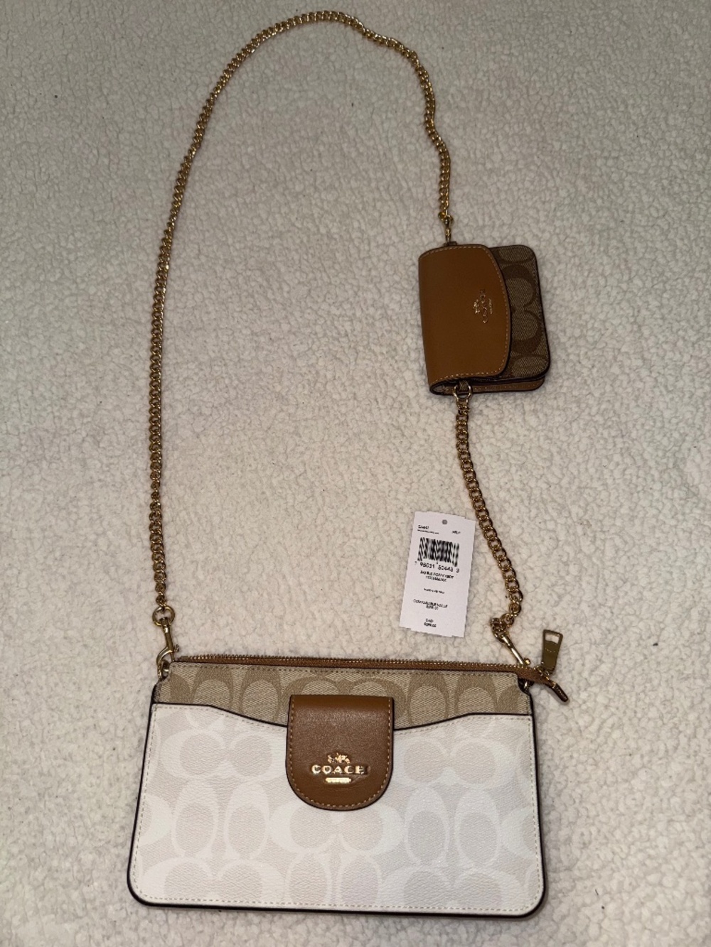 Coach white and tan crossbody bag with beige and brown signature logo pattern